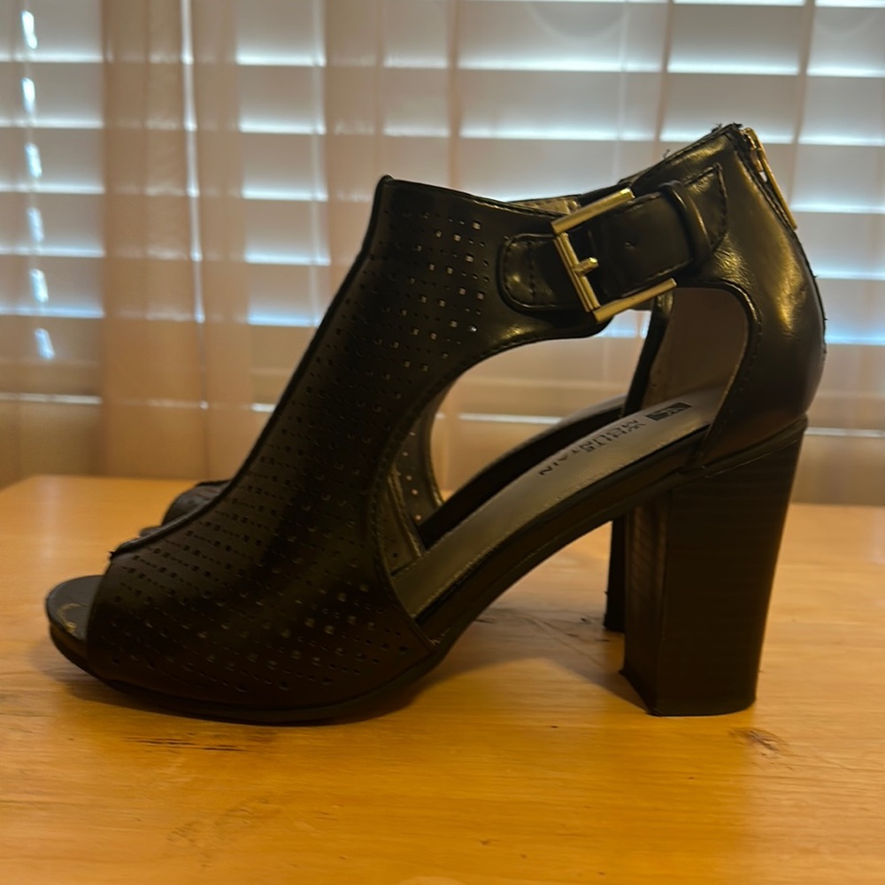 Super cute black heels with buckles on sides and zipper on backs